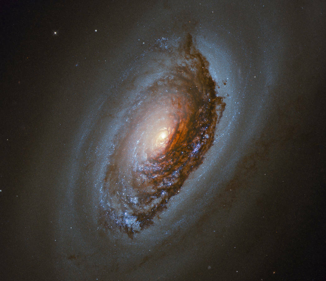 Known as the "Black Eye" or "Evil Eye," galaxy NGC4826 has a peculiar trait. The gas in its inner regions and outer regions rotate in opposite directions, and new stars form where the rotating gases collide.