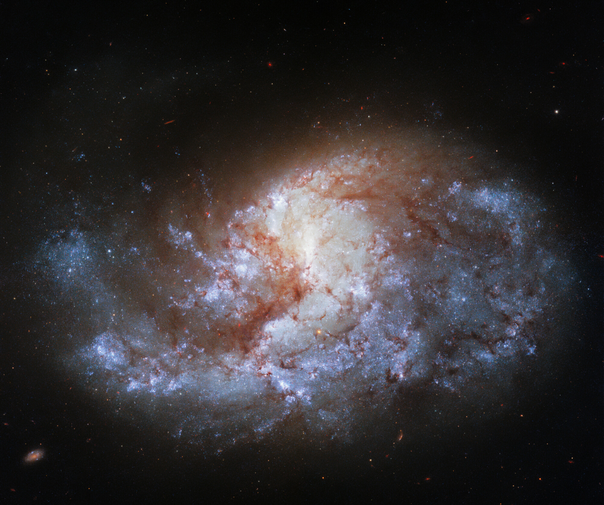 Sixty-eight million light-years from Earth, the spiral galaxy NGC 1385, shines in a constellation named Fornax, which is the Latin word for furnace.