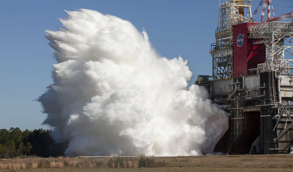 the SLS rocket's four main engines firing in a thrust test