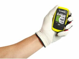 Hand wearing white golf glove holding yellow golf gps