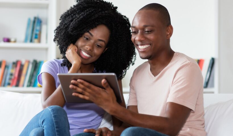 Couple watching movie on tablet computer