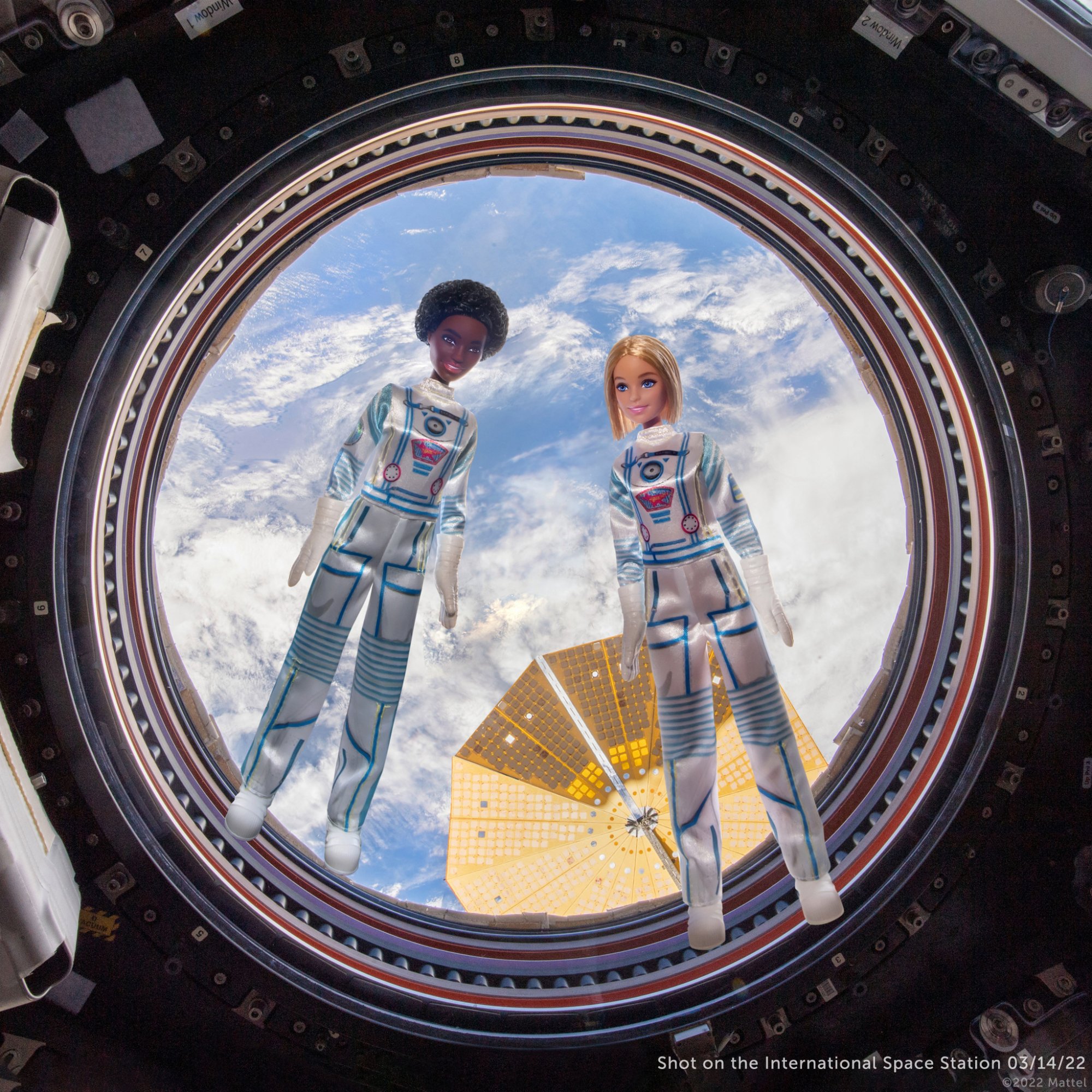 Barbies floating in the International Space Station cupola 