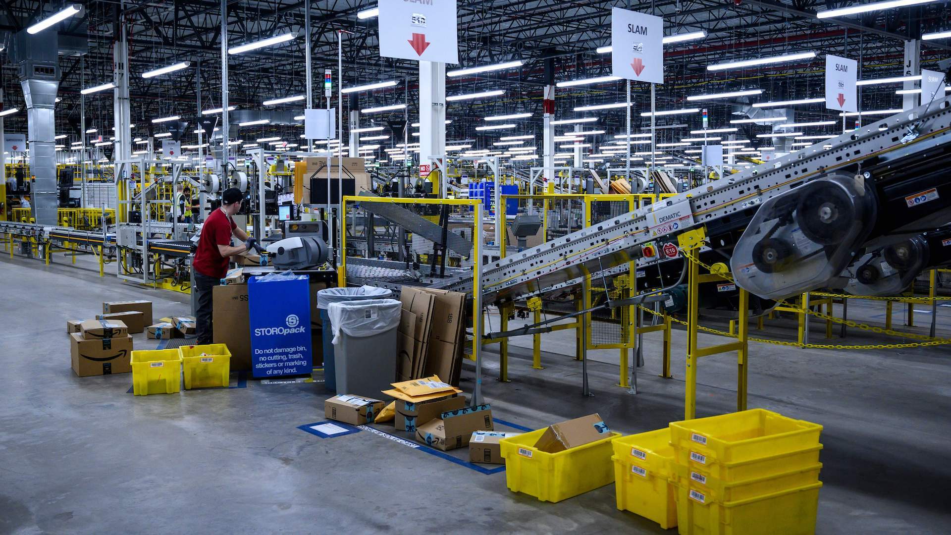 A man works at a conveyor belt at the 855,000-square-foot Amazon fulfillment center in Staten Island, one of the five boroughs of New York City, on February 5, 2019