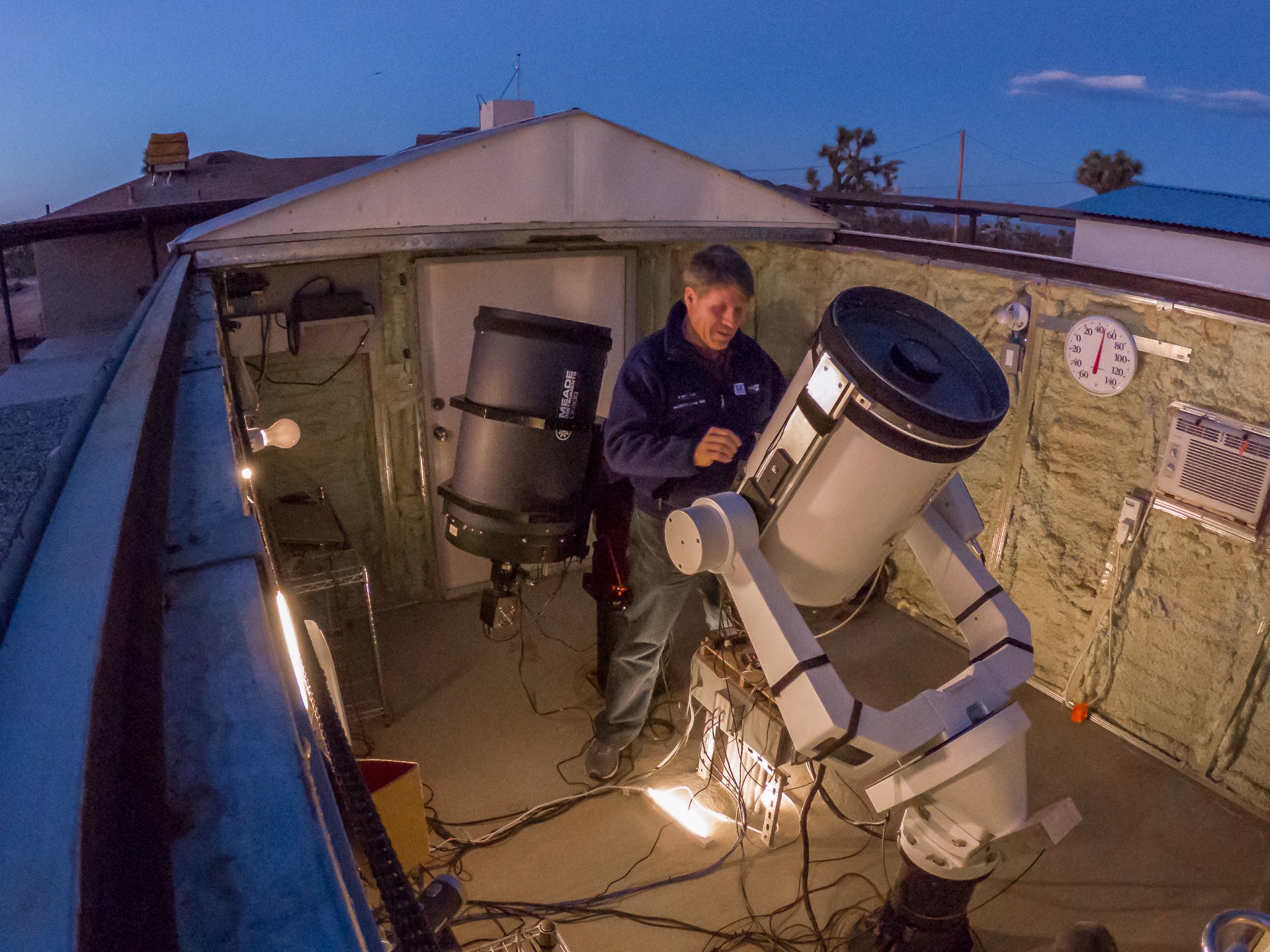 amateur astronomer working on telescope