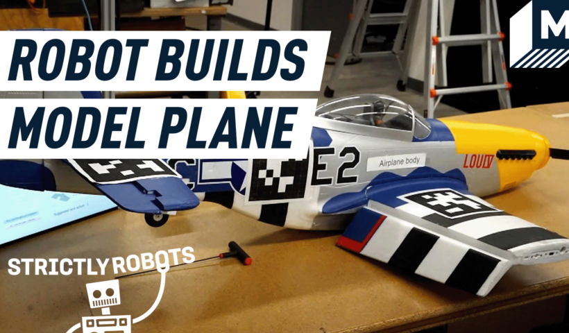 A finished model airplane built by a human and their robot assistant.